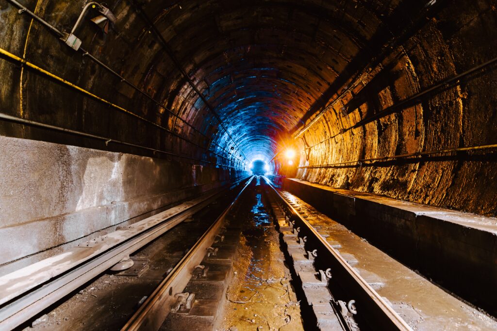 Shotcrete application in underground infrastructure maintenance, showcasing underground pipe repair and culvert rehabilitation services to enhance tunnel fireproofing and fire safety.