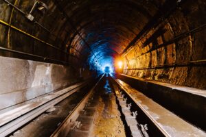 Shotcrete application in underground infrastructure maintenance, showcasing underground pipe repair and culvert rehabilitation services to enhance tunnel fireproofing and fire safety.